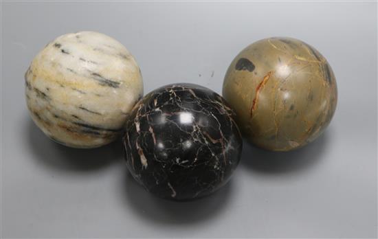 Three marble carpet balls